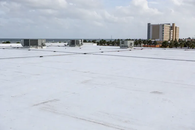 Low-slope commercial roof on a coastal Florida building near Daytona Beach