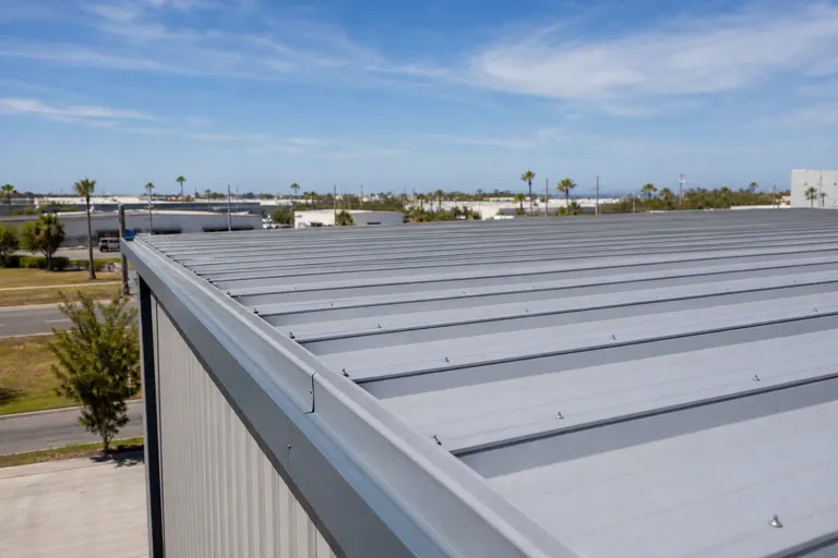 Commercial metal roofing seam and fastener area checked for weather exposure