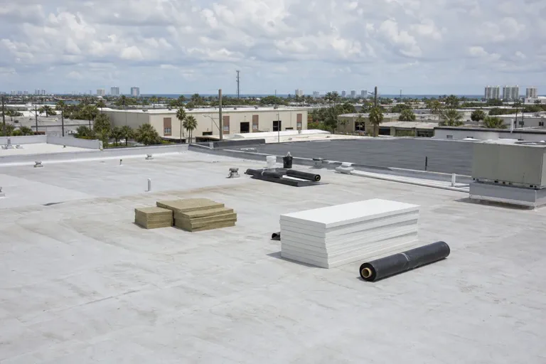 Commercial roof replacement planning scene with roof access and surface conditions